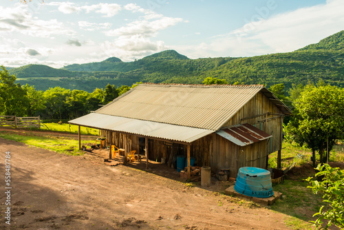 Rustic wooden house with fiber cement roofing in the countryside of Sao Francisco de Paula, Brazil © Helissa