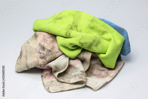 Pile of dirty old rag suspended isolated on white background. photo