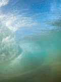 View of incoming breaking wave from underwater.