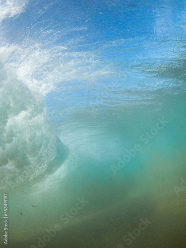 View of incoming breaking wave from underwater.