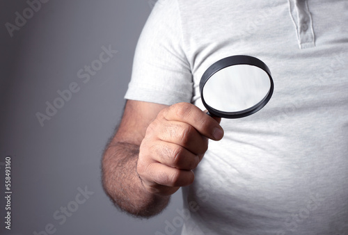 magnifying glass in the man hand