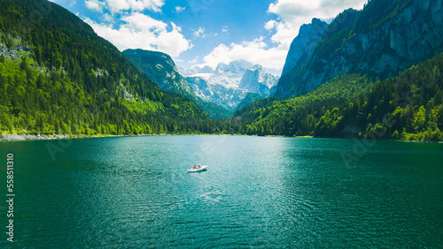 Gosausee, a beautiful lake and a white boat with moutains in Austria. © Sanfira