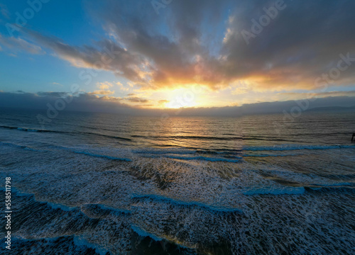 An Aerial UAV Drone View of a Beach Sunset on the Pacific Ocean 