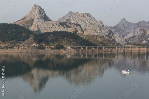 Reflections in the reservoir of RiaÃ±o, LeÃ³n. Spain. photo
