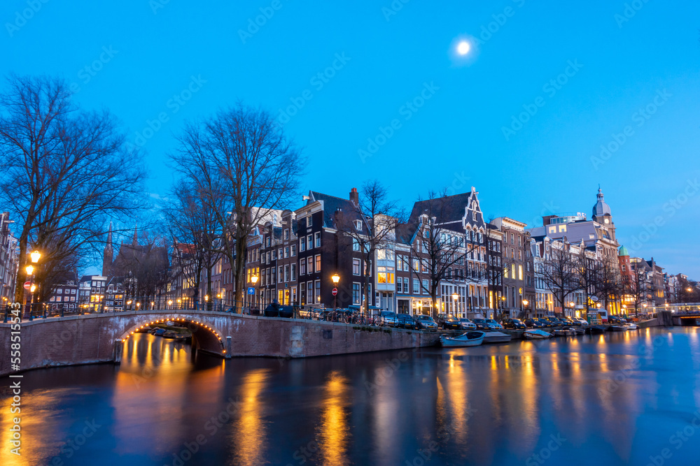 Obraz premium Amsterdam canal at twilight in winter, Amsterdam is the capital and most populous city in Netherlands.