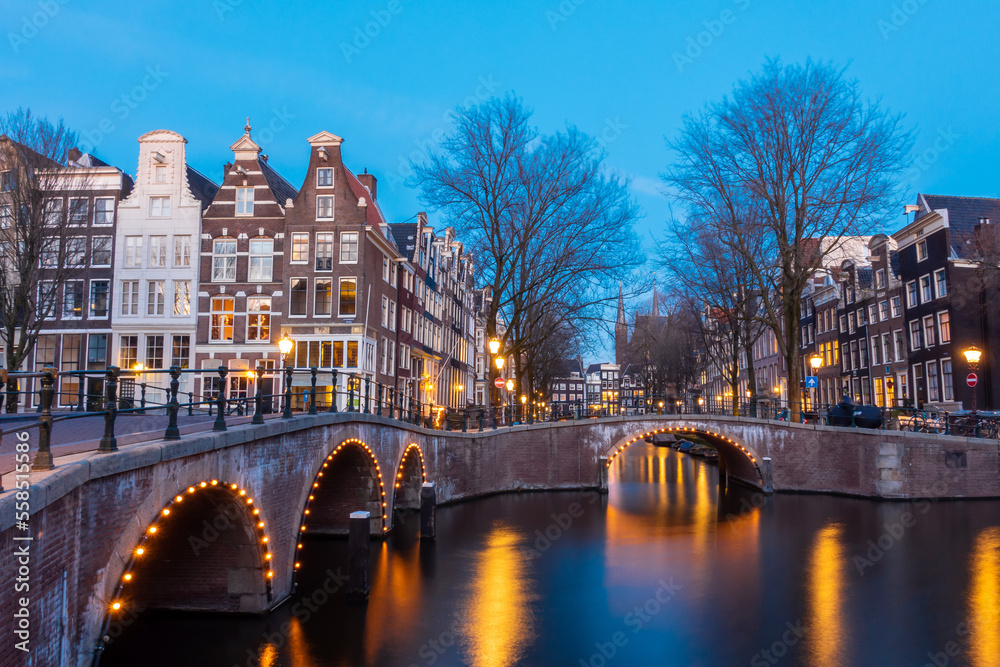 Amsterdam canal at twilight in winter, Amsterdam is the capital and most populous city in Netherlands.
