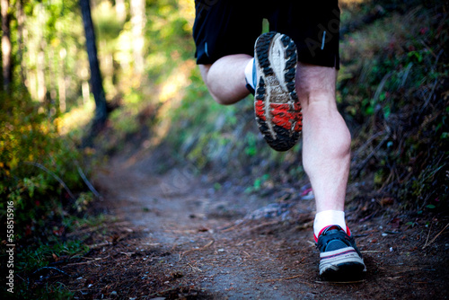 Runner running in Rattlesnake Mountains near Missoula, Montana, USA photo