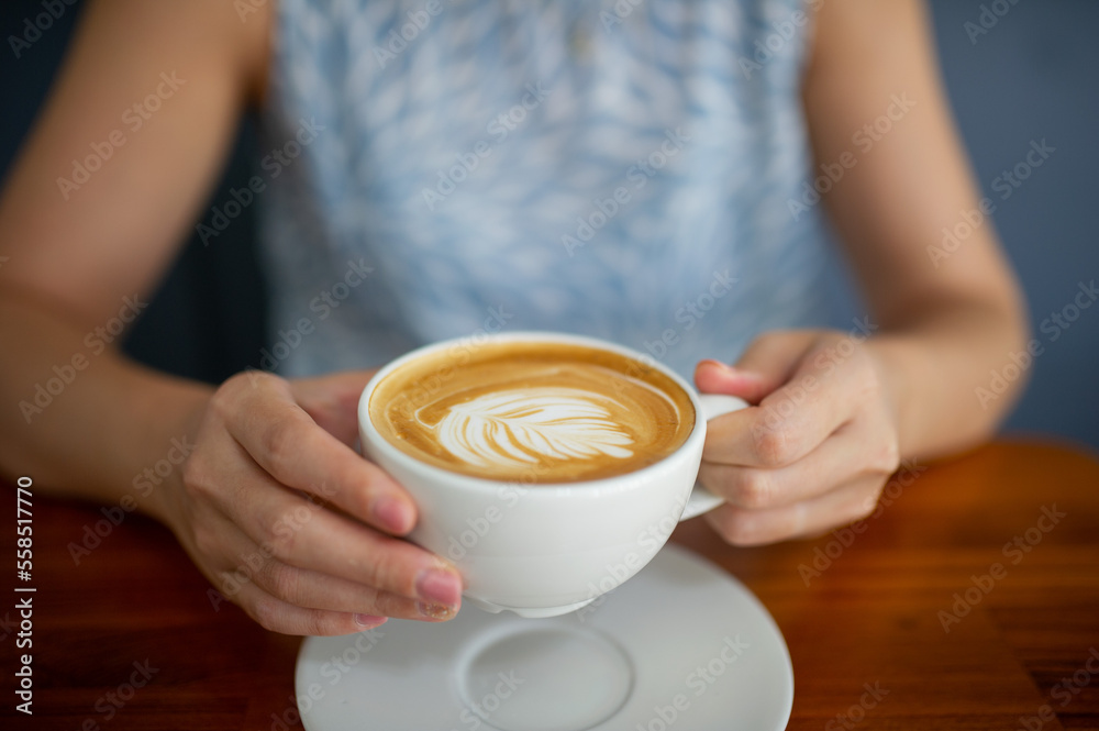 closeup hand drinking hot coffee, relax time closeup hand drinking hot coffee, relax time