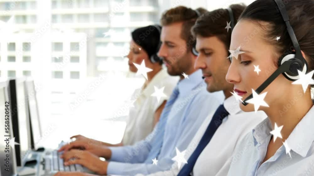Animation of stars over caucasian customer representatives wearing headphone and working on computer Animation of stars over caucasian customer representatives wearing headphone and working on computer