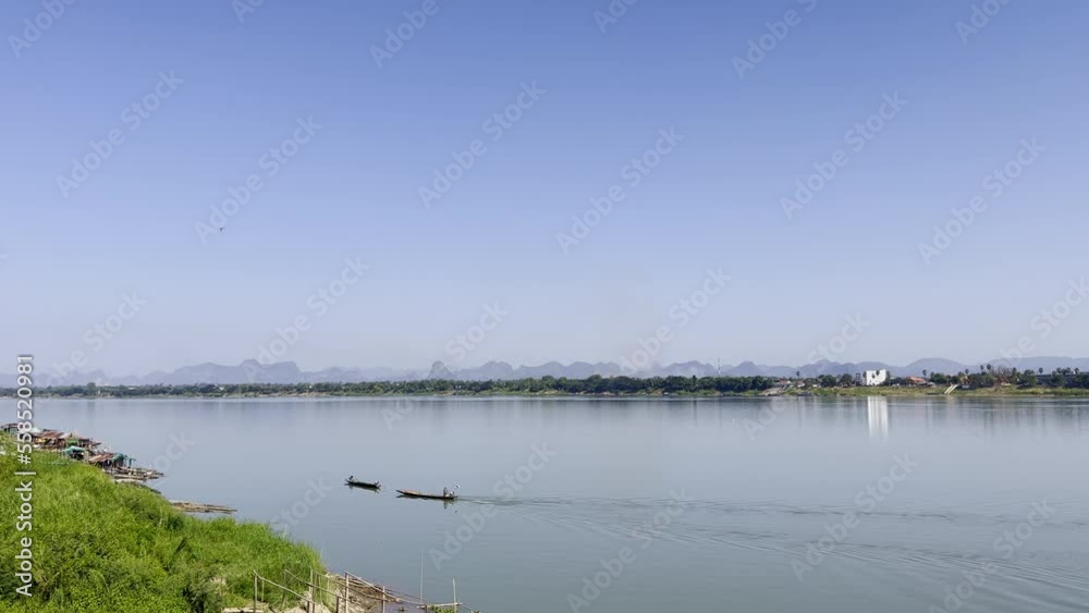 Mekong River in Nakhon Phanom Province in Northeastern Thailand. The fishermen are sailing offshore to start their work in the morning. Mekong River in Nakhon Phanom Province in Northeastern Thailand. The fishermen are sailing offshore to start their work in the morning.