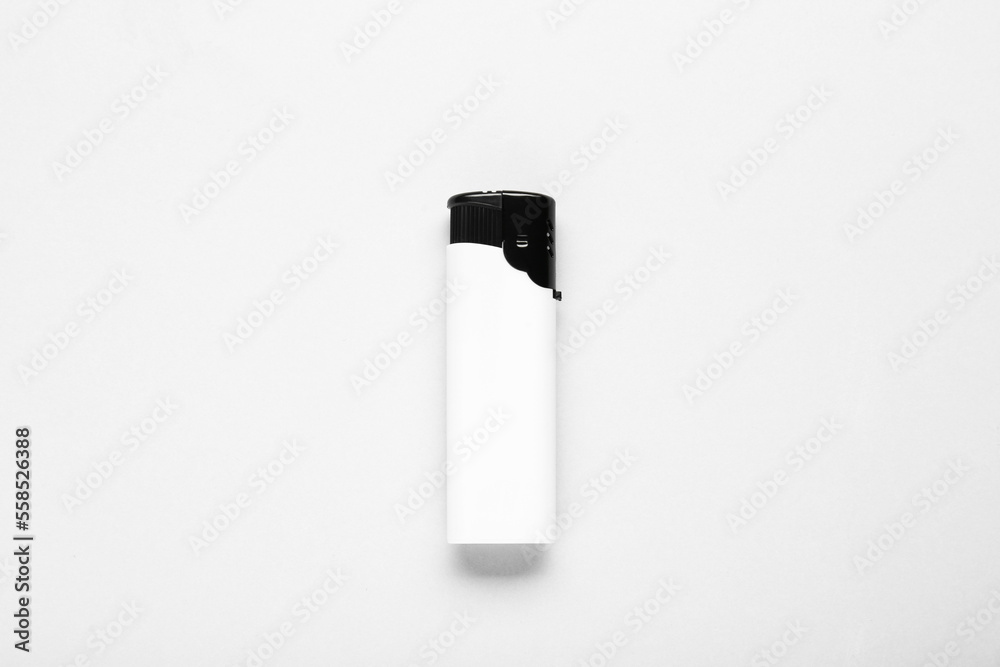 Stylish small pocket lighter on white background, top view Stylish small pocket lighter on white background, top view