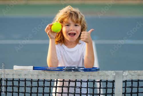 Tennis kids. Tennis child player on tennis court. Sport concept. © Volodymyr