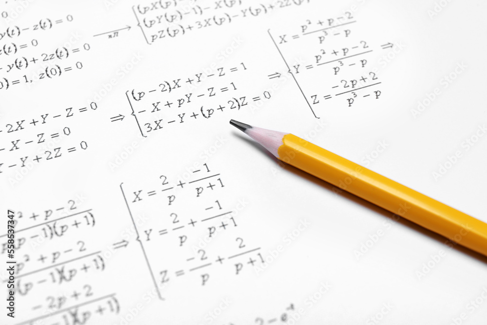 Sheet of paper with mathematical formulas and pencil, closeup Sheet of paper with mathematical formulas and pencil, closeup