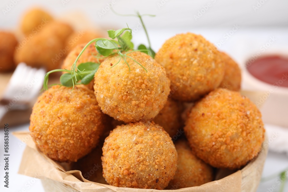 Delicious fried tofu balls with pea sprouts in bowl, closeup Delicious fried tofu balls with pea sprouts in bowl, closeup