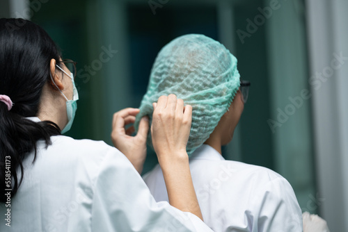 Scientist wearing glasses a...