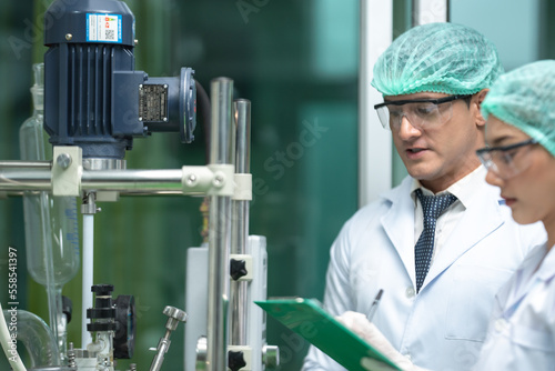 Scientist wearing glasses a...