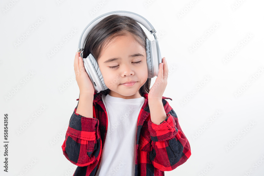 Lttle girl Asia cute enjoying her music headphones (isolated on white) Lttle girl Asia cute enjoying her music headphones (isolated on white)