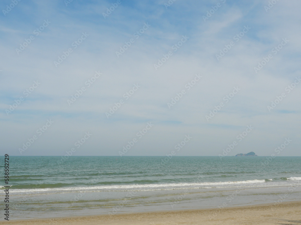 The beach with blue sky in background, Wave in the sea were hitting the shore, Thailand