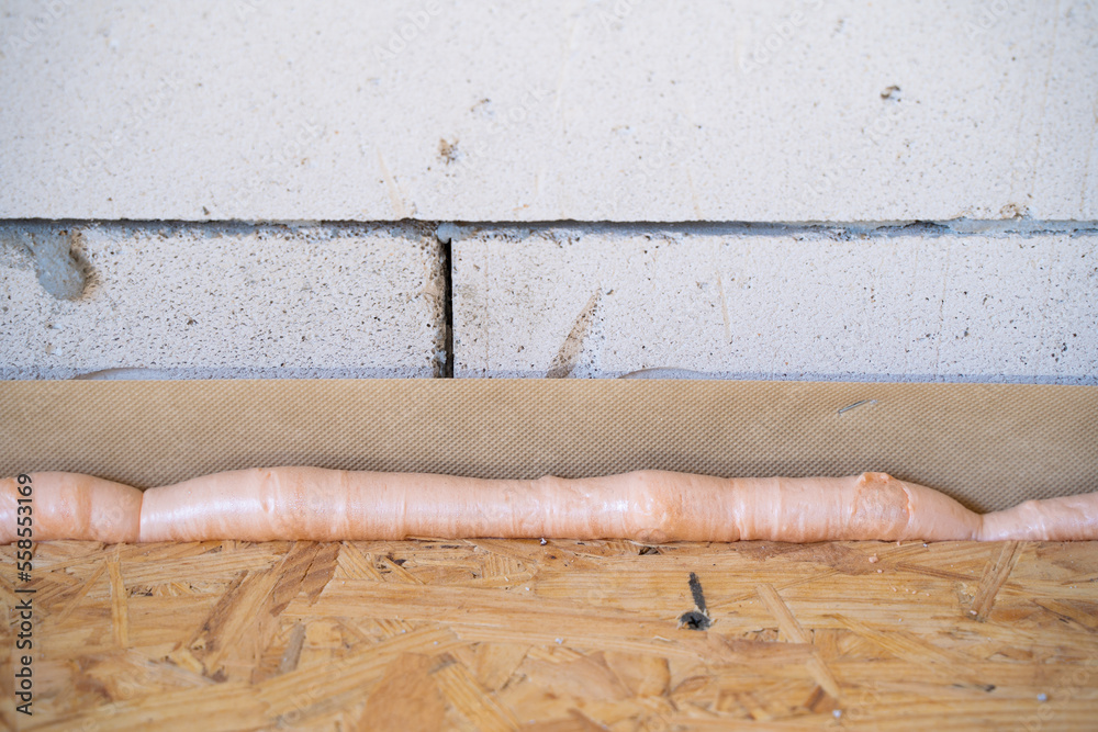 Floor insulation between floors using a hydrobarrier. Closeup of the