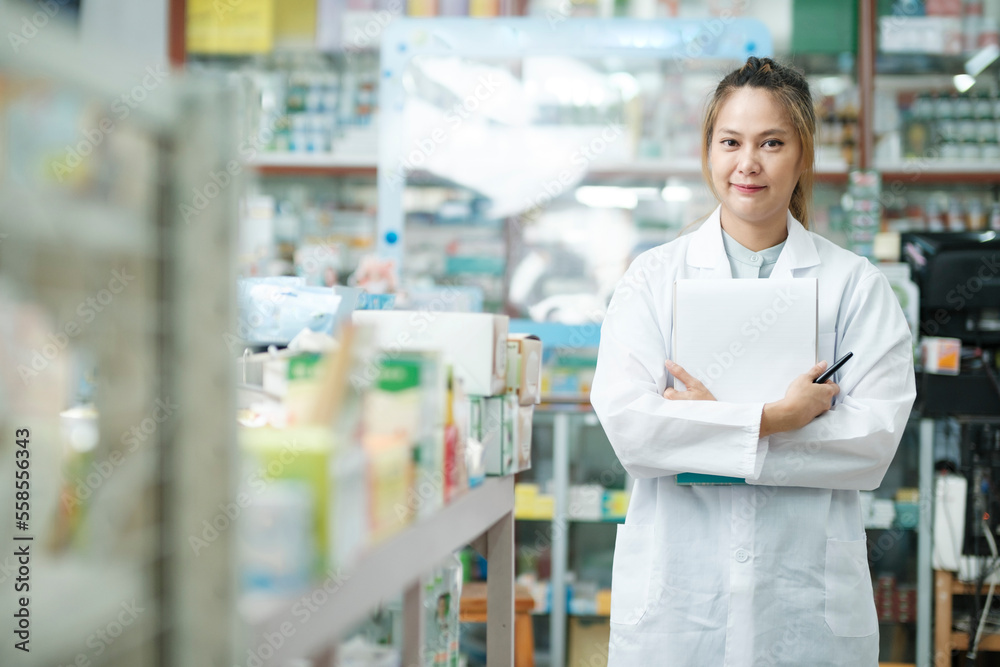 Portrait of pharmacist working in drugstore.