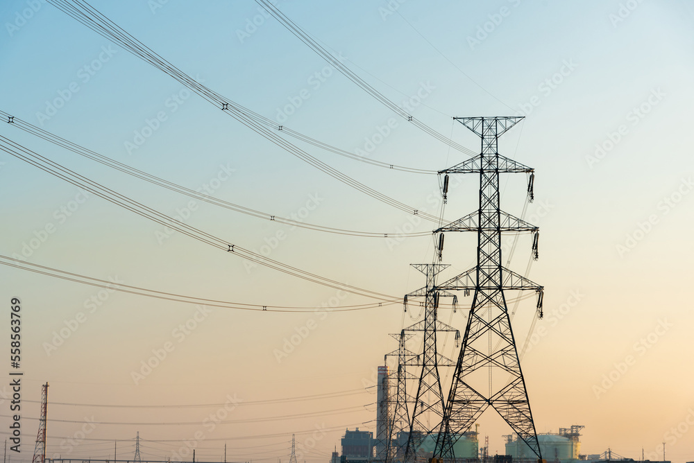 High-voltage poles supply power to the petrochemical industry.