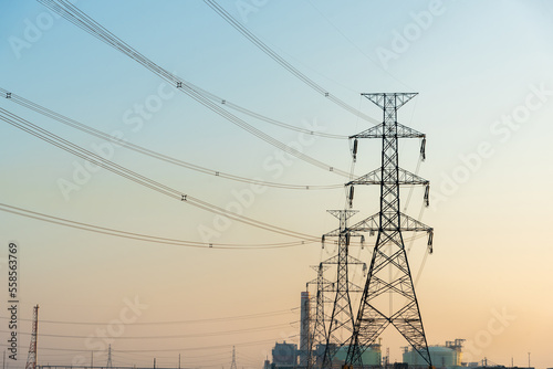 High-voltage poles supply power to the petrochemical industry. © TWEESAK