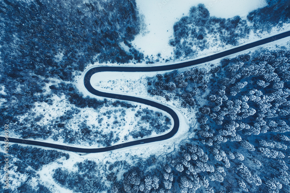 Winter road in the mountains drone view