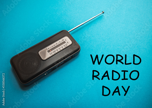 World Radio Day 13 February text with radio on blue background. Selective focus photo