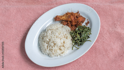Ayam goreng Kalasan and Gulai daun ubi, Indonesian traditional cuisine made from fried chicken