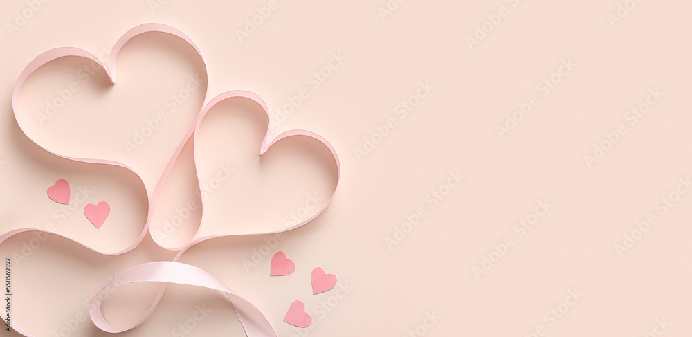 Hearts made of pink ribbon on beige background with space for text. Valentine's Day celebration