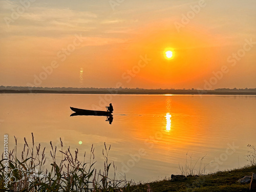 sunset on the river © Pradeep
