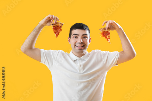 Young man with pieces of ta...