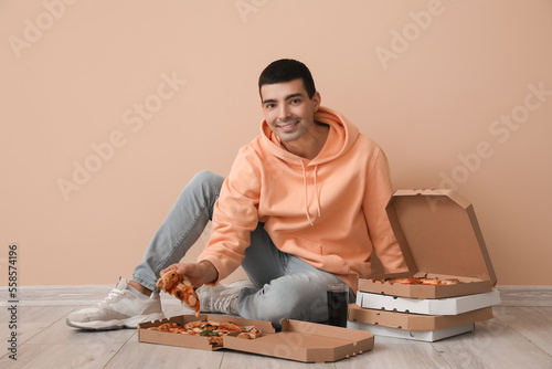 Young man with boxes of tas...