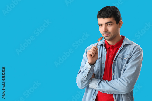 Young man with tablespoon o...
