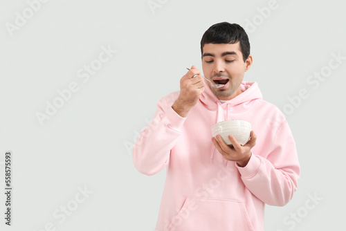 Young man with silver spoon...