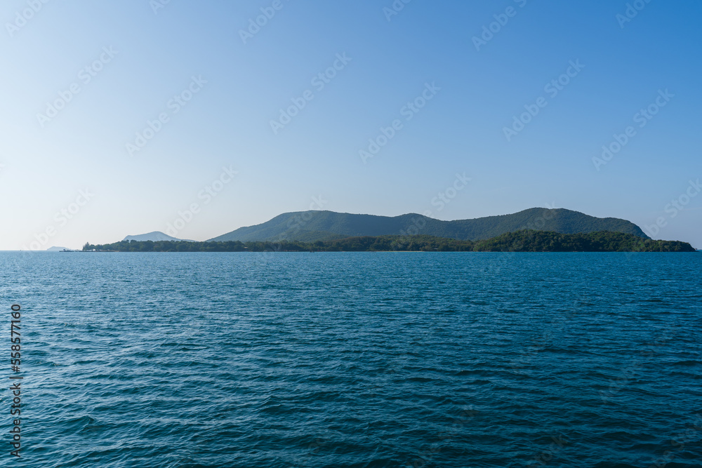 Natural landscape of green island and blue sea. Clear blue water, overlooking the wide sea, beautiful blue sea waves, Panoramic view of blue calm ocean.