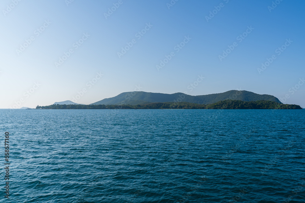 Natural landscape of green island and blue sea. Clear blue water, overlooking the wide sea, beautiful blue sea waves, Panoramic view of blue calm ocean. Natural landscape of green island and blue sea. Clear blue water, overlooking the wide sea, beautiful blue sea waves, Panoramic view of blue calm ocean.
