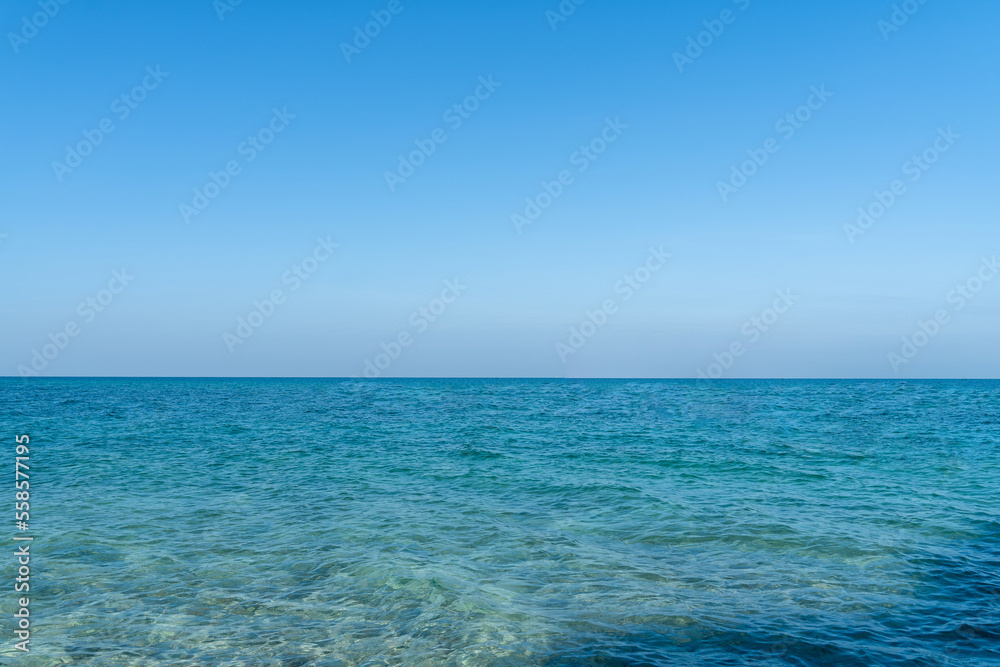 The water sea is clear and bright blue. wide sea view, landscape blue ocean waves.	

