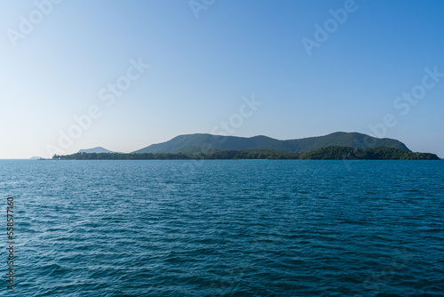 Natural landscape of green island and blue sea. Clear blue water, overlooking the wide sea, beautiful blue sea waves, Panoramic view of blue calm ocean.