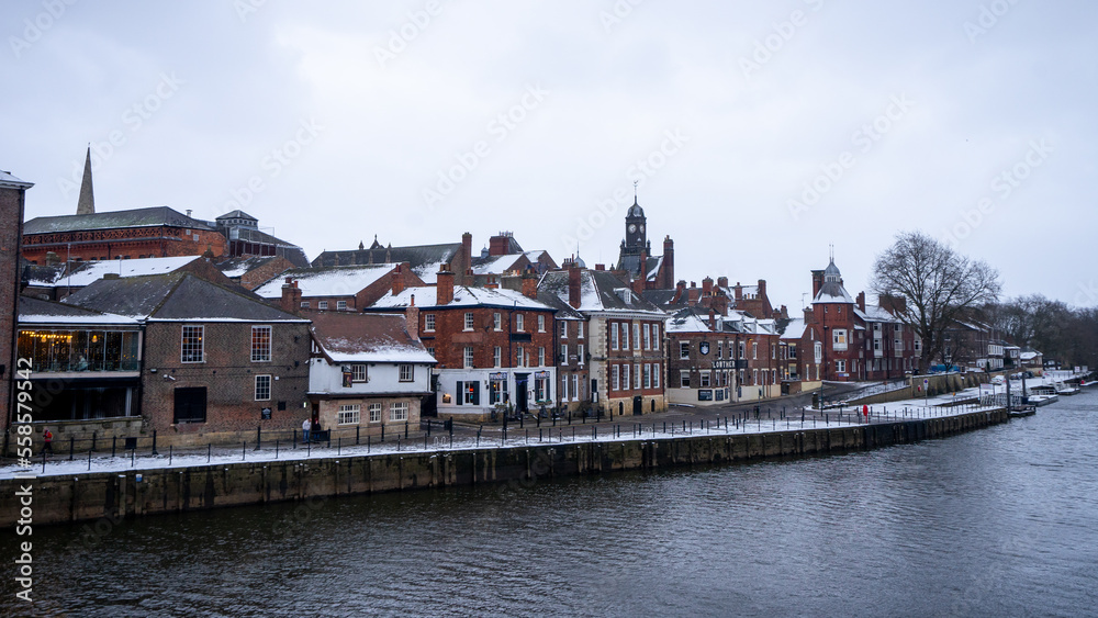 Obraz premium Beautiful view of York around Ouse Bridge , River Ouse with classic buildings in old town during winter evening at York , United Kingdom : 1 March 2018