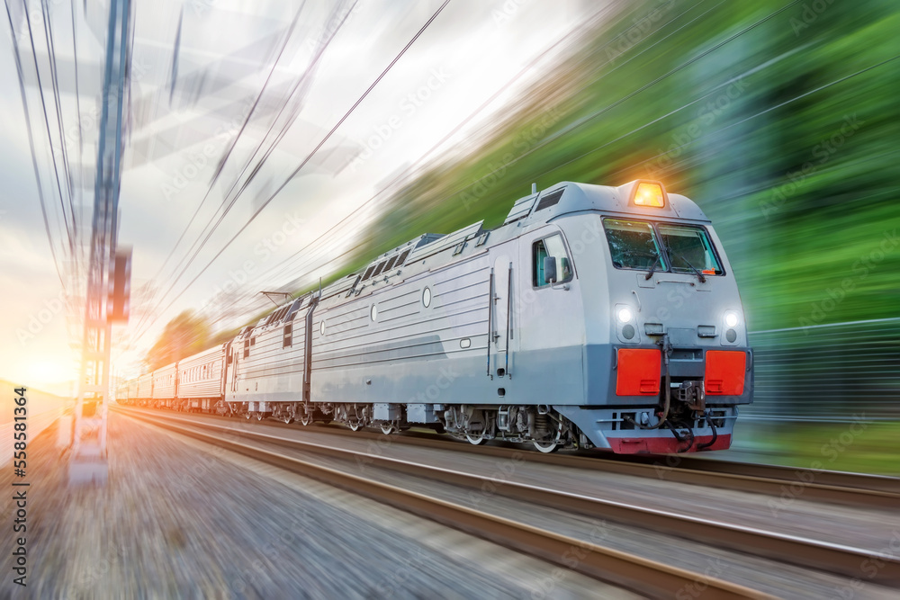 Naklejka premium Passenger electric train traveling speed railway wagons journey light