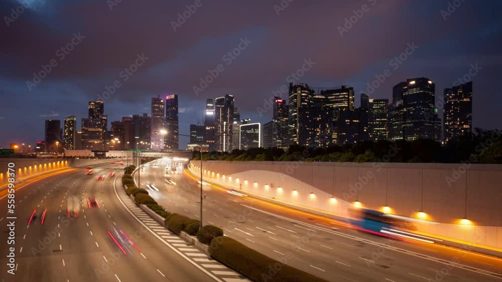 Singapore time lapse from day to night with traffic in highway with skyscrapers in background Singapore time lapse from day to night with traffic in highway with skyscrapers in background