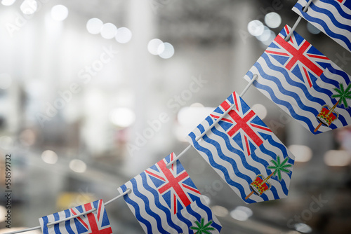 A garland of British Indian Ocean Territory national flags on an abstract blurred background photo