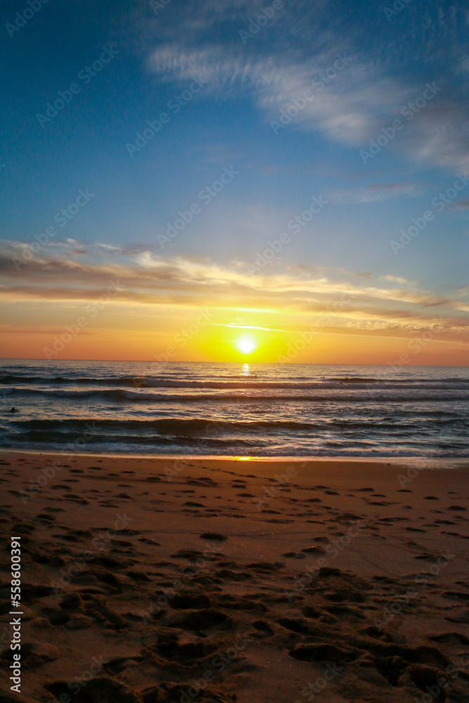 Beautiful sunset at the beach in portugal at the atlantic ocean close to lissabon. Wallpaper surf Beautiful sunset at the beach in portugal at the atlantic ocean close to lissabon. Wallpaper surf