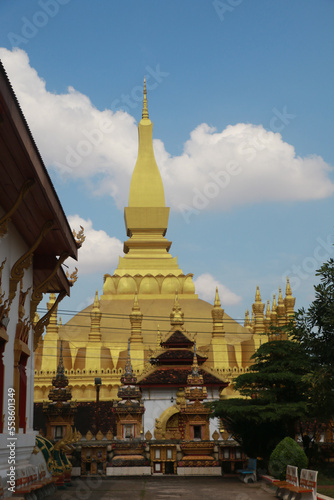 Wallpaper of Vientiane the golden city with sleeping buddha statue and golden temple. Popular for the giant gate. Asia
