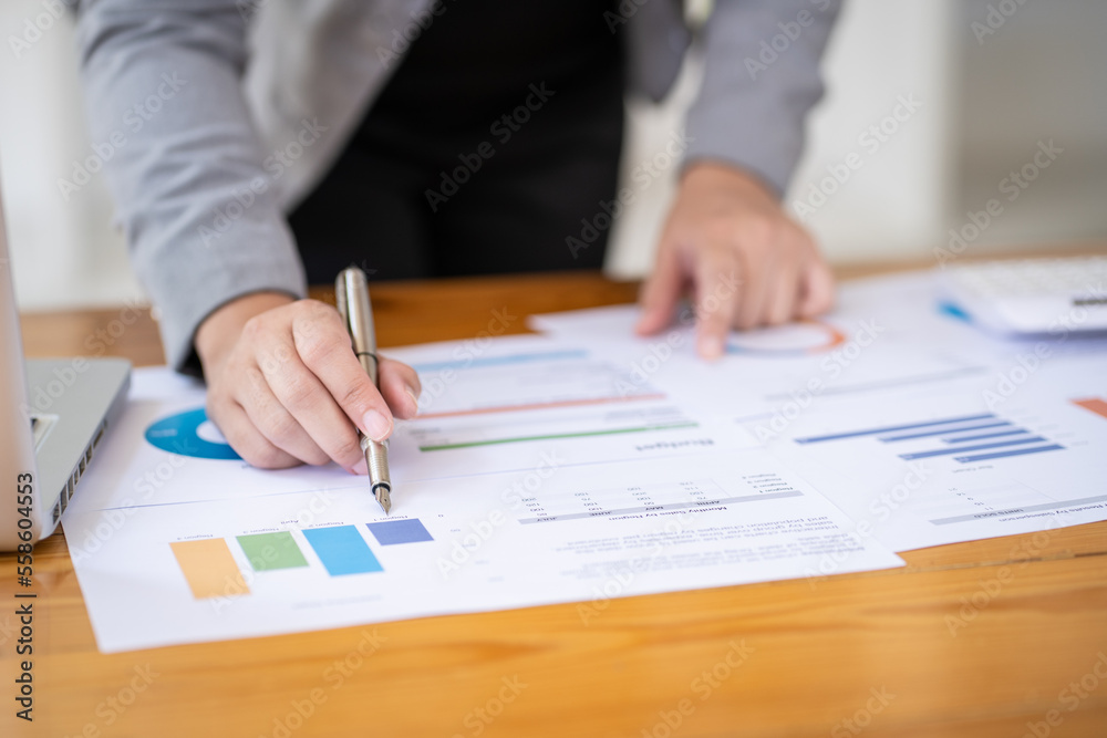 Calculating Cost Economic budget saving and investment concept analyzing investment charts and calculator Accounting Concept Calculating Cost Economic budget saving and investment concept analyzing investment charts and calculator Accounting Concept