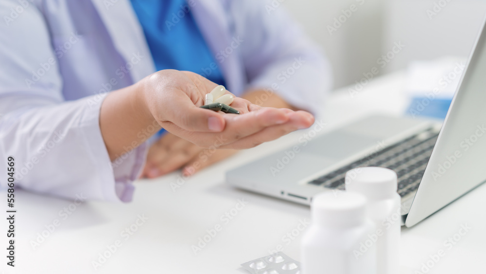 Professional medical doctor hand giving medicine. protect against coronavirus COVID-19 medicine healthcare concept doctor giving pills to patient Professional medical doctor hand giving medicine. protect against coronavirus COVID-19 medicine healthcare concept doctor giving pills to patient