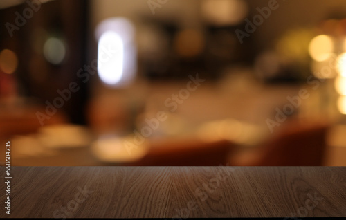 Wood table top in front of abstract blurred background. Empty wooden table space for text marketing promotion. blank wood table surface copy space © Charlie's