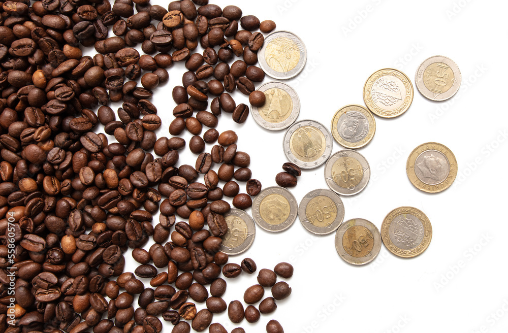 coffee grains with coins on a white background. coffee grains with coins on a white background.