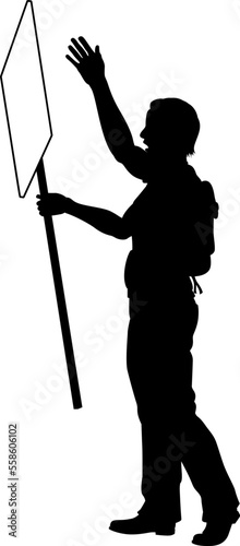 Protestor or demonstrator at a demonstration march, picket line or strike protest rally in silhouette. Holding up a banner or picket sign board placard.